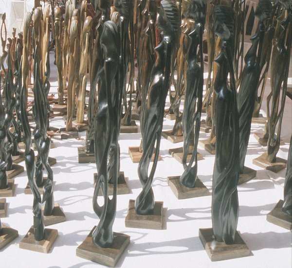 Statues out of different kinds of woods being sold to tourists everywhere