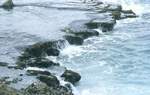 Rocky shore (looks volcanic) at Baracoa