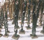 Statues out of different kinds of woods being sold to tourists everywhere